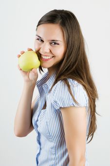 Beautiful Young Woman Biting A Green Apple Stock Photos