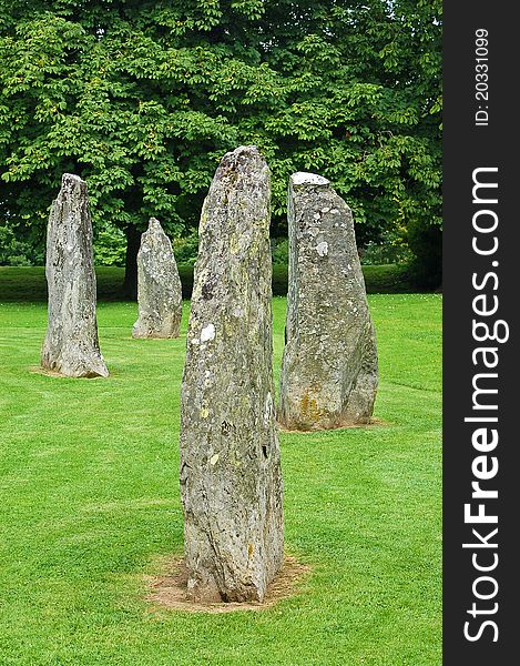 Welsh Gorsedd religious standing stones, in a parkland setting against a backdrop of trees