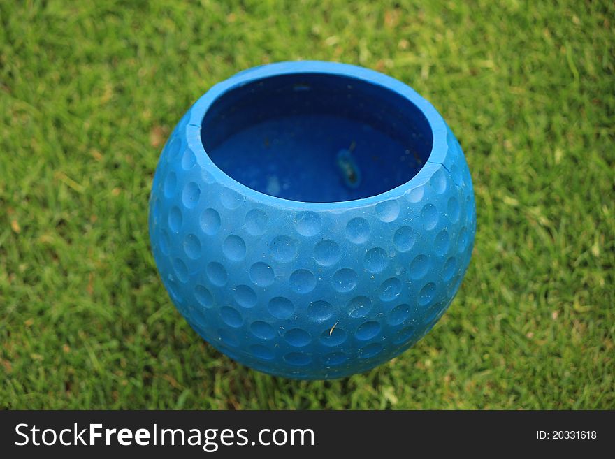 Golf ball blue grass green