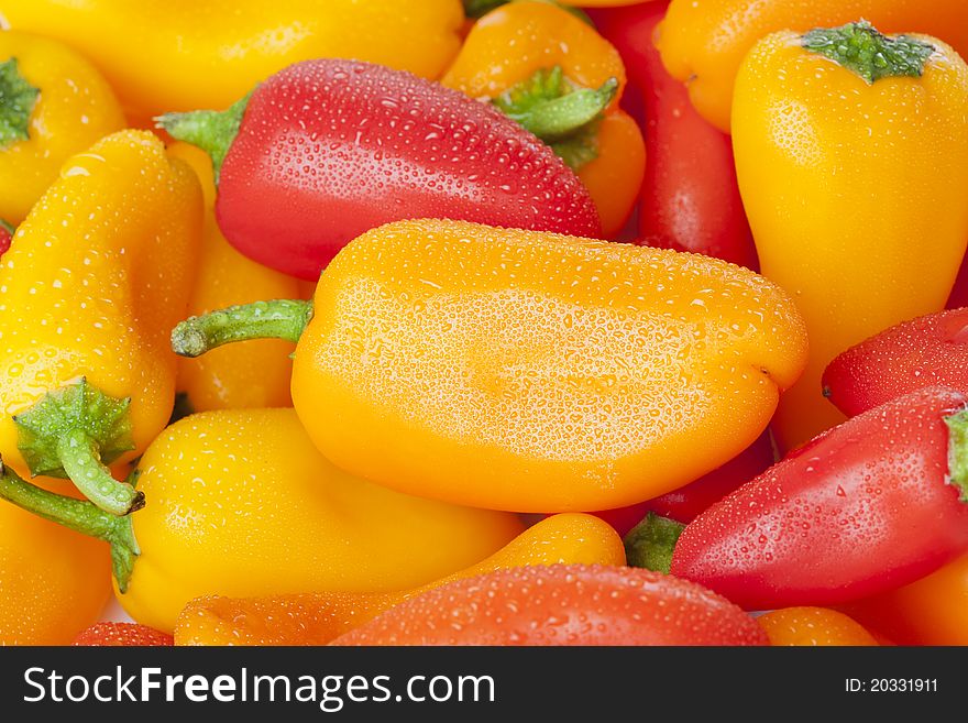 A group of baby peppers against a white background