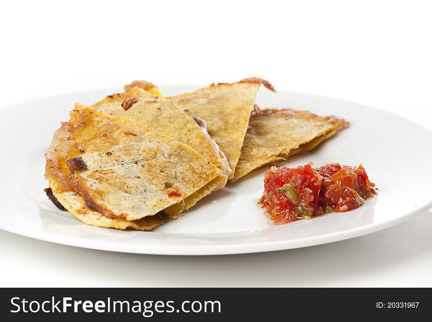 A cheese quesadilla  against a white background