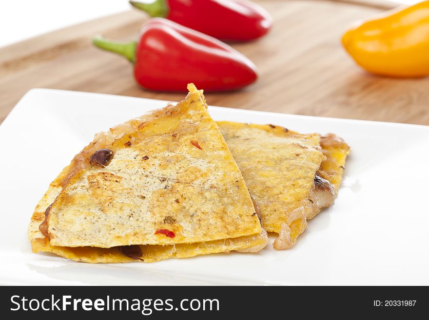 A cheese quesadilla against a white background