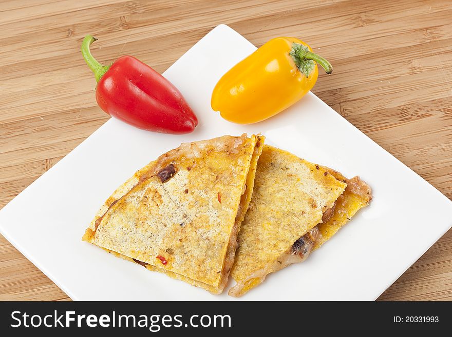 A cheese quesadilla against a white background