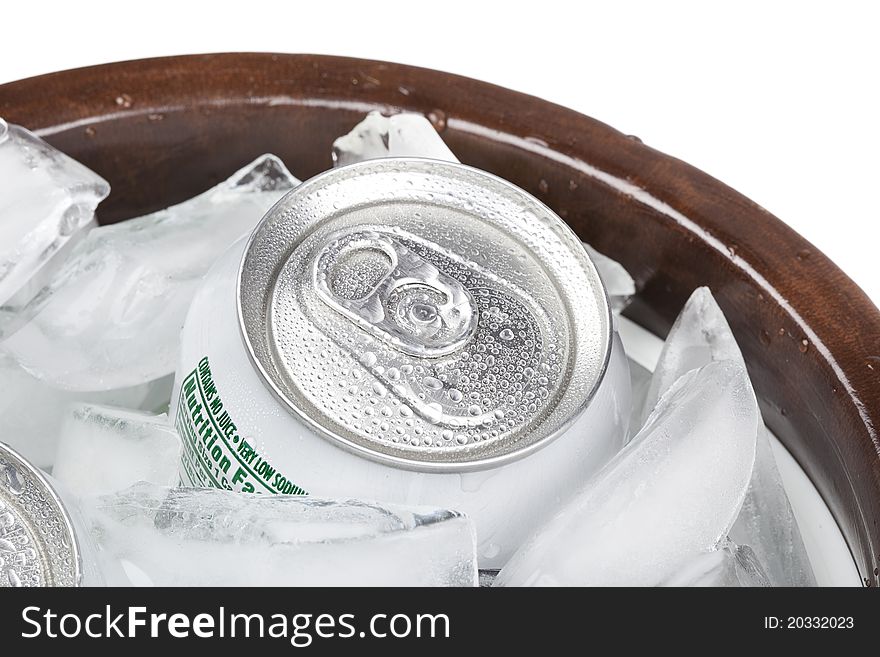 A group of soda cans in a container of ice
