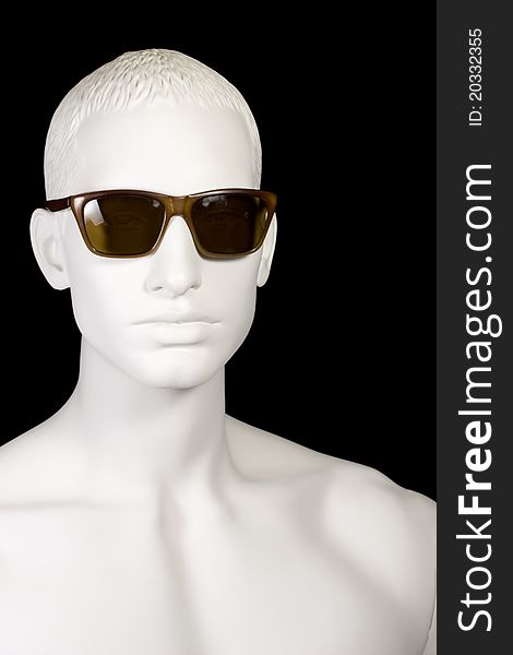A handsome male mannequin wearing vintage wayfarer style sunglasses. A handsome male mannequin wearing vintage wayfarer style sunglasses