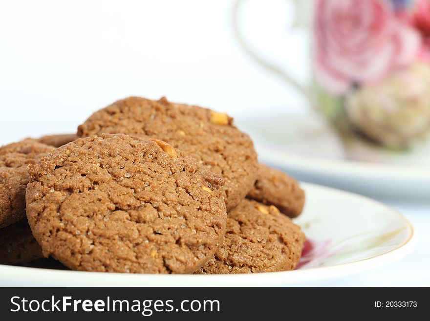 Cookies and coffee morning refreshments on white background