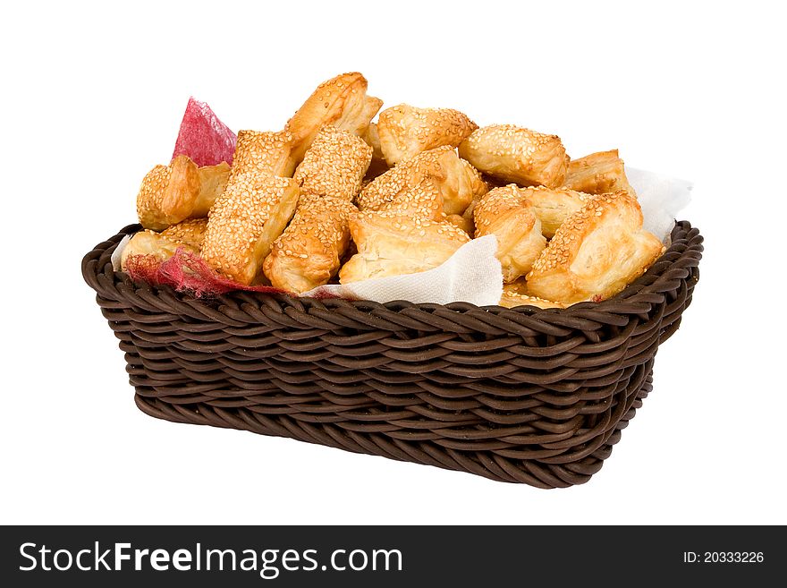 Bread muffins in a wooden brown cart isolated on white