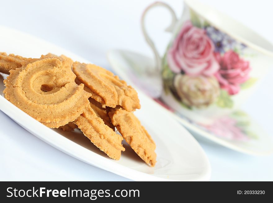 Cookies and coffee morning refreshments on white background