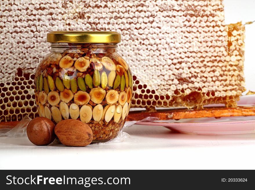 Natural honey in a glass jar