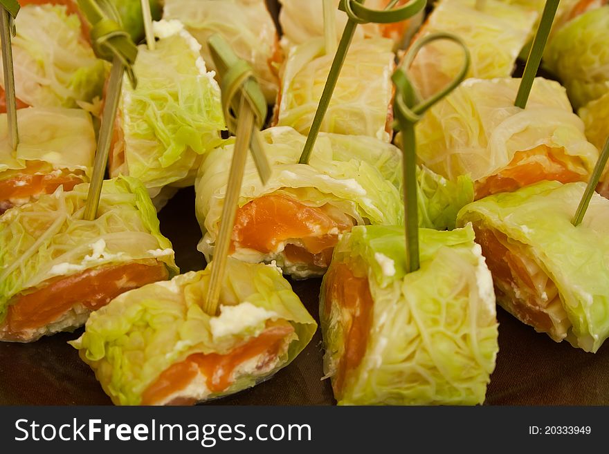 Canape with salmon and leaf on skewer