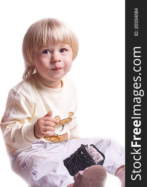 Small girl eating cookies on a white background