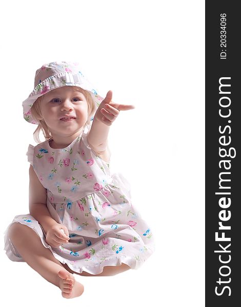 The little girl in a dress with arm outstretched on a white background