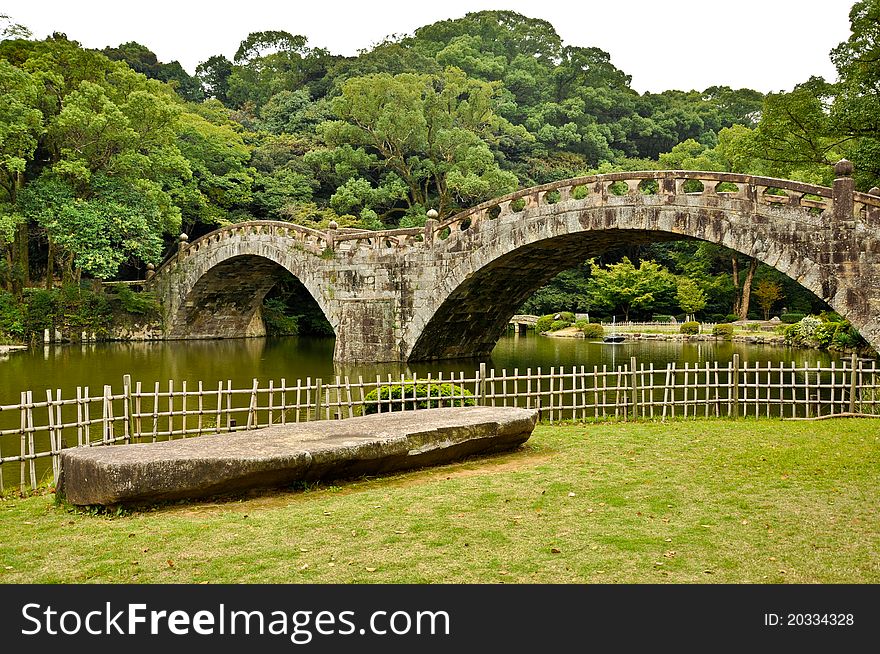 Stone Bridge In Japanese Garden