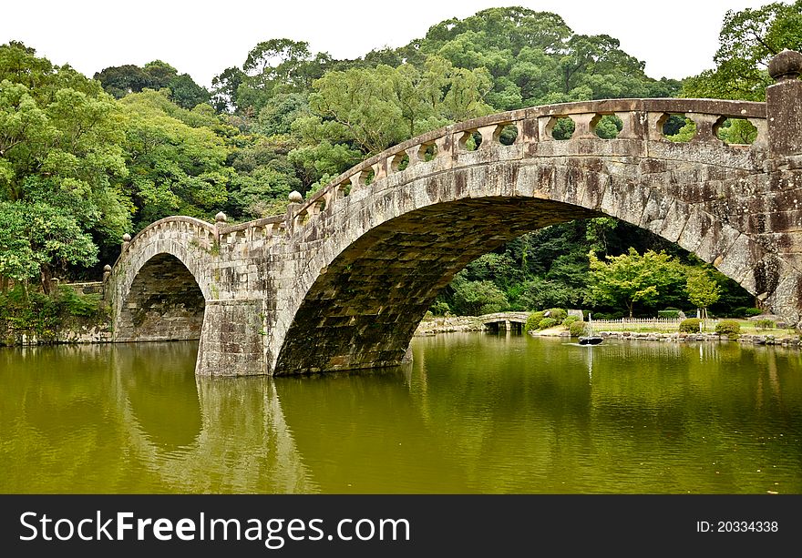 Stone bridge in Japanese garden at Isahaya, Japan