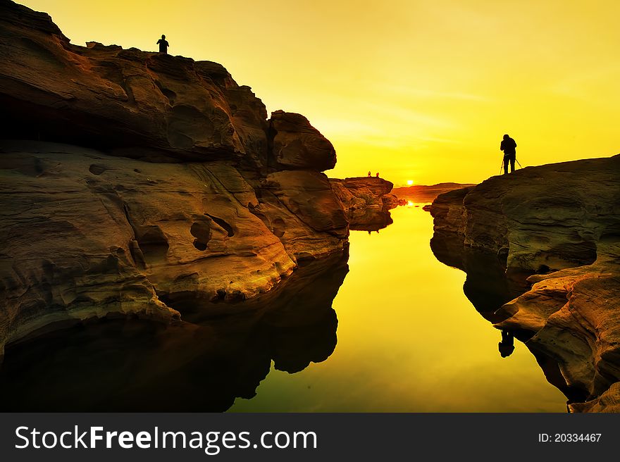 Silhouette of many photographer shooting sunrise