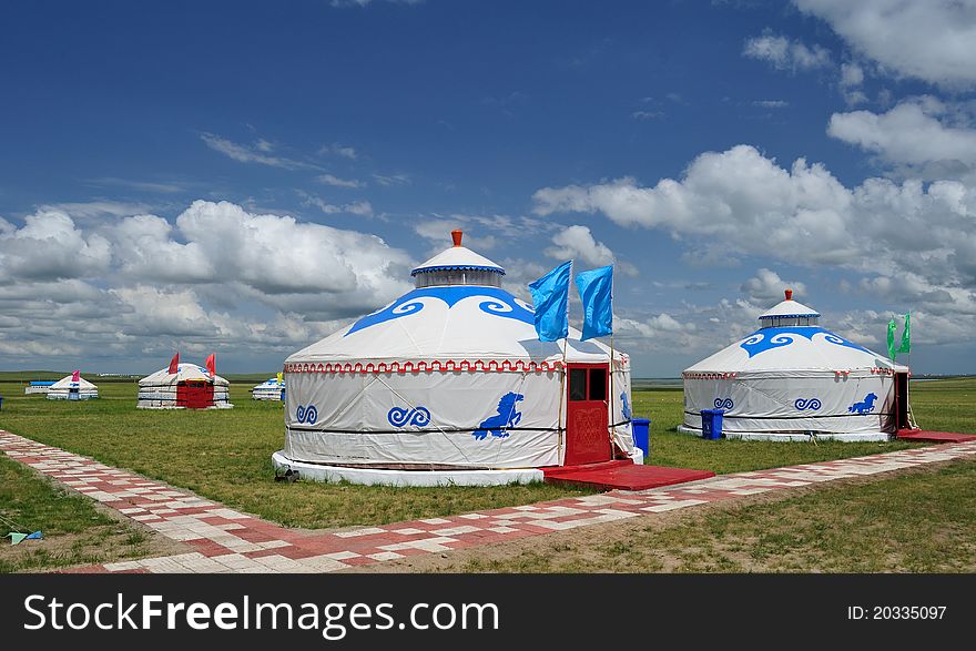 Mongolia packages with blue flags under blue sky and white clouds, beautiful. Mongolia packages with blue flags under blue sky and white clouds, beautiful.