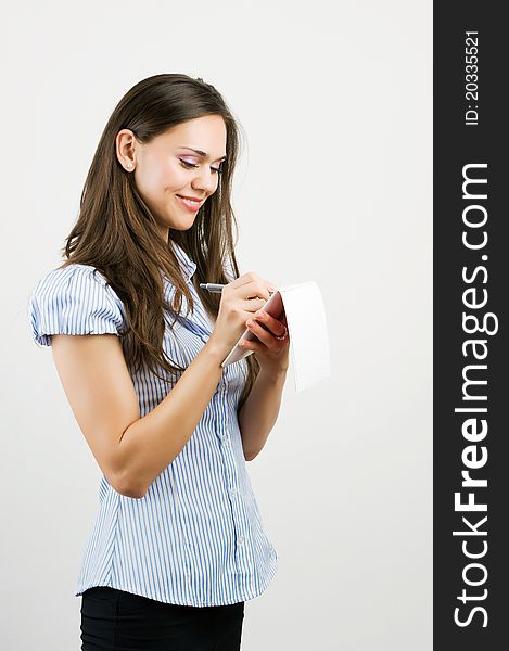 Business woman with notebook in the office