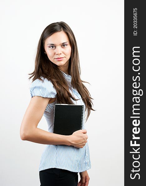 Happy smiling cheerful young business woman with notepad, isolated on white background