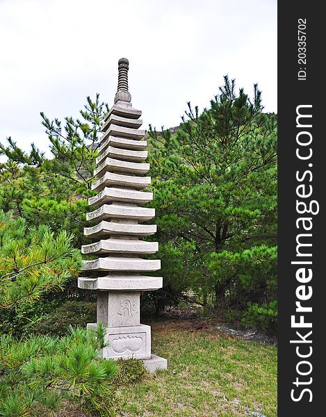 Stone Statue In The Japanese Garden