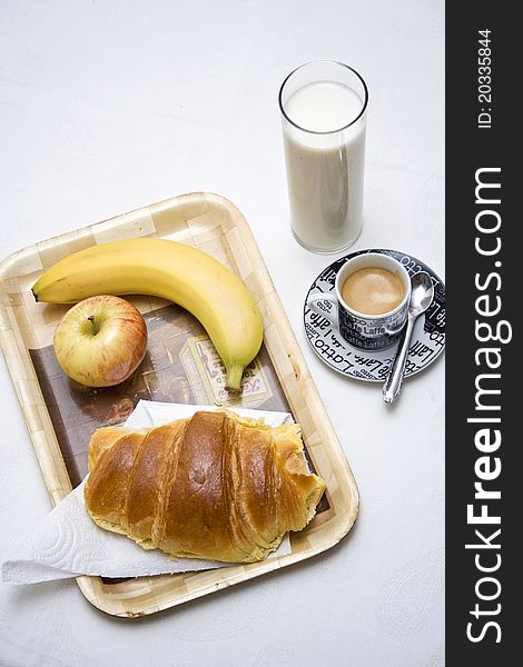 Healthy breakfast with milk, coffee, fruit and croissant. Healthy breakfast with milk, coffee, fruit and croissant