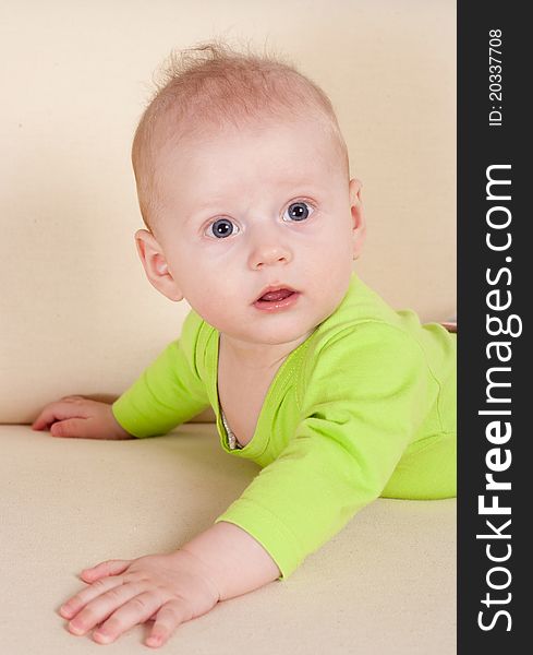 Portrait of a cute baby lying on sofa. Portrait of a cute baby lying on sofa