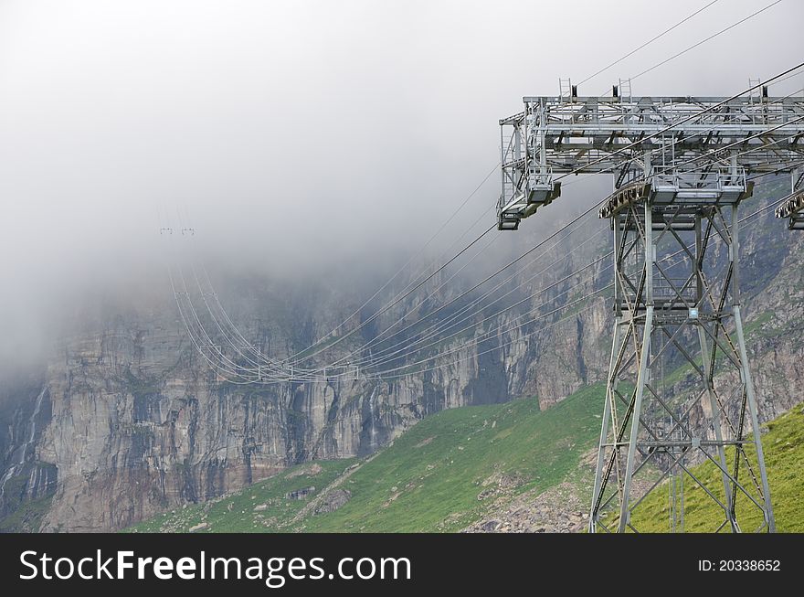 Mountain cable car pillar in the fog. Mountain cable car pillar in the fog