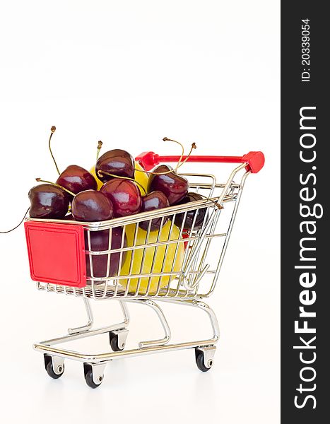 Red shopping cart with plum and cherry