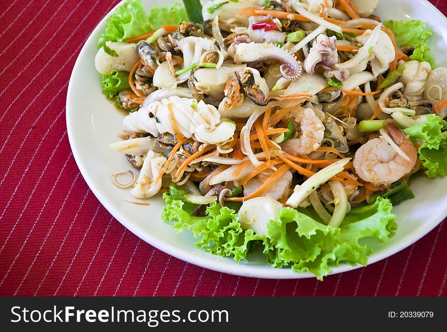 Thai style salad seafood on red back ground