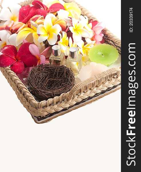 Colorful of plumeria, perfume bottles and candle in tray. Colorful of plumeria, perfume bottles and candle in tray