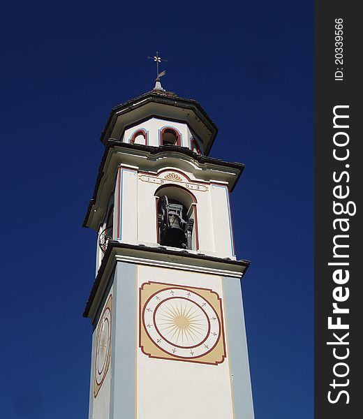 Church tower of the village of Bosco Gurin in the mountains of Switzerland. Church tower of the village of Bosco Gurin in the mountains of Switzerland