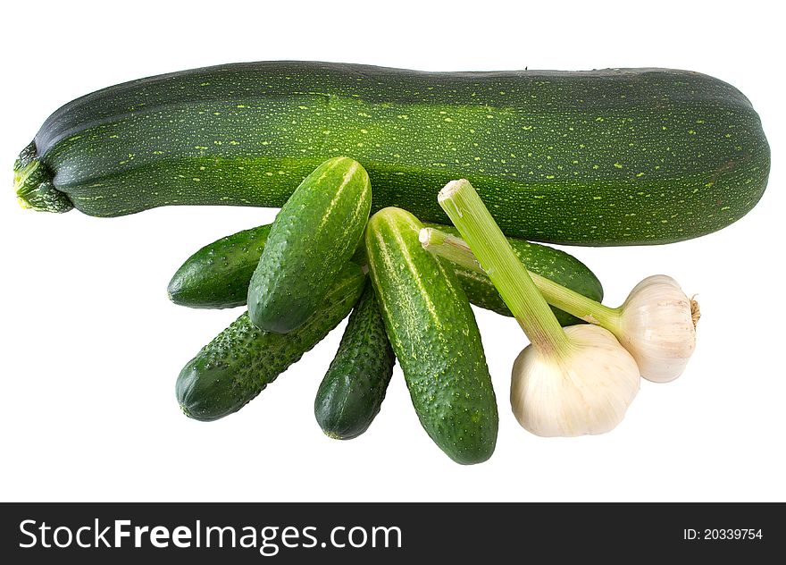 Cucumber garlic zucchini isolated on white