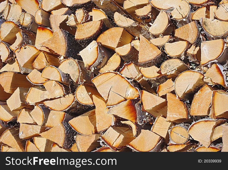 Pile of birch firewood stacked for winter