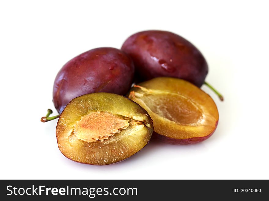 Red plum fruit isolated on white background.