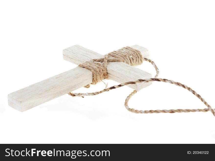 Wooden antique look crucifix necklace isolated on white background