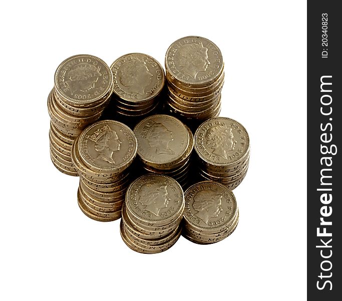 British pound coins arranged in piles. British pound coins arranged in piles