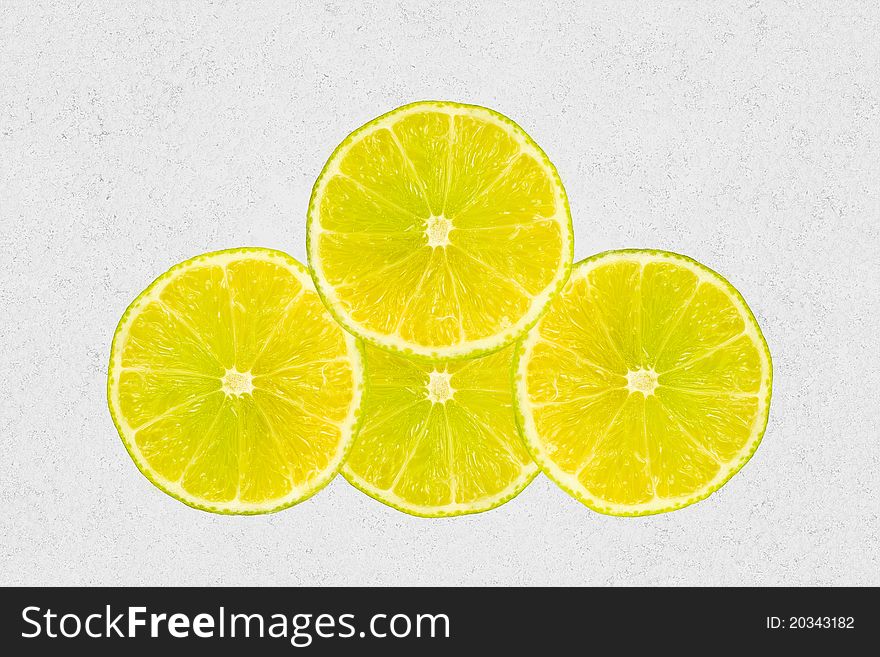 Four slices of lemons isolated on canvas background. Four slices of lemons isolated on canvas background.