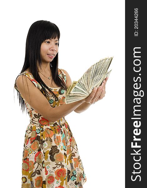 Happy asian woman starring at her money, isolated on white background. Happy asian woman starring at her money, isolated on white background