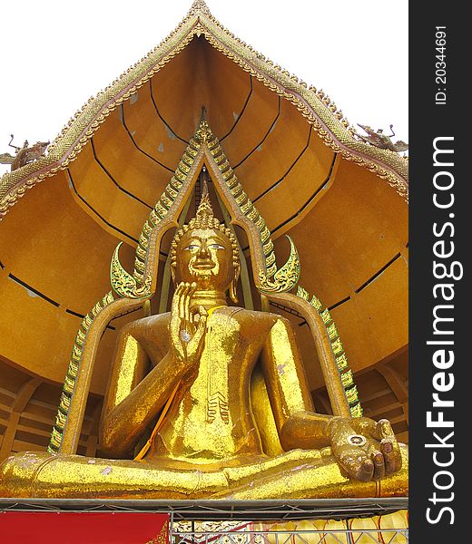 Massive golden Buddha in sitting pose with open palm in Kanchanaburi, Thailand. Massive golden Buddha in sitting pose with open palm in Kanchanaburi, Thailand.