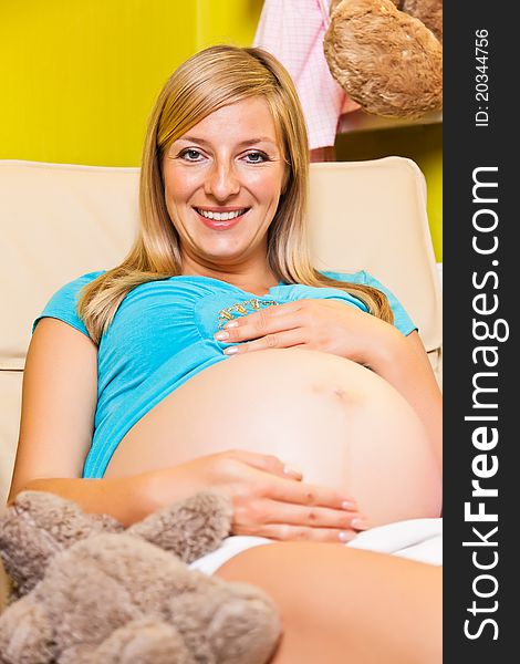 Pregnant Woman In Baby Room