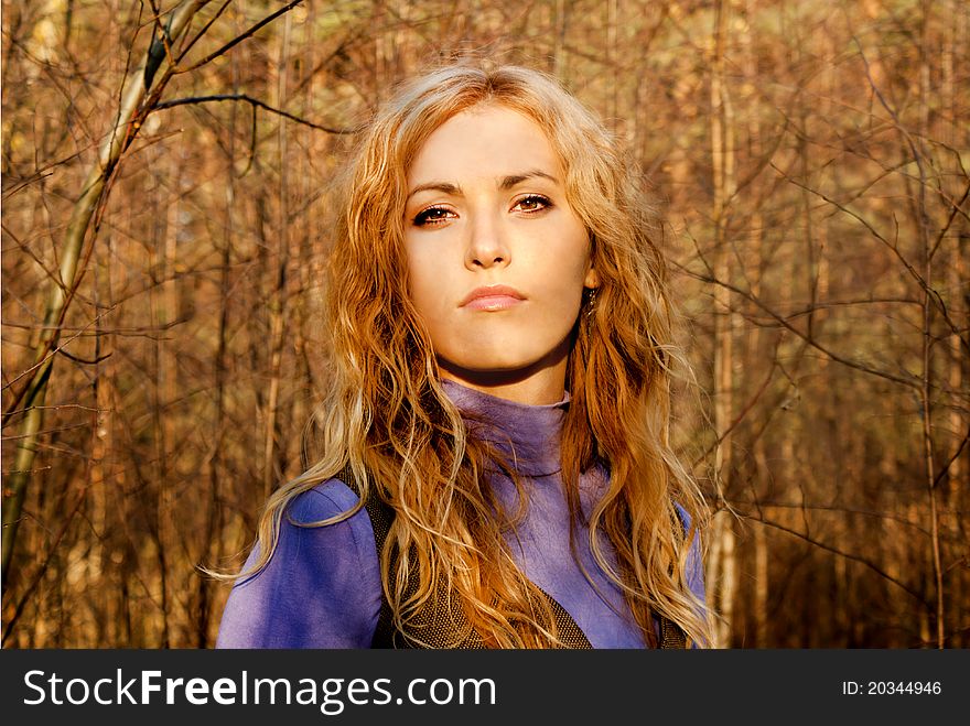 Beautiful blondy girl in the forest