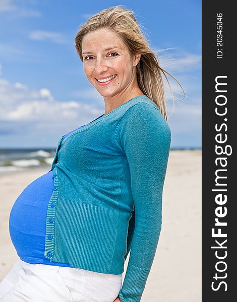 Pregnant Woman On Beach