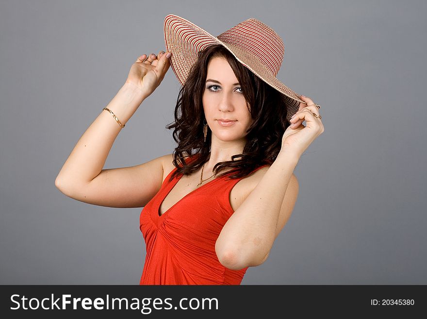 Portrait of a pretty girl in straw hat