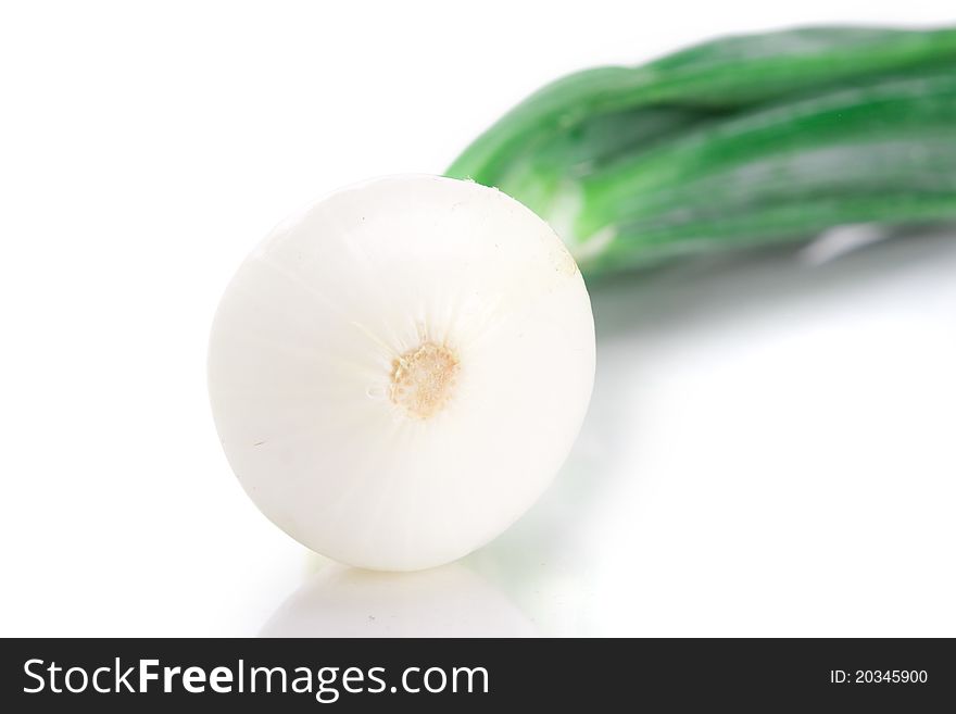 A single stalk of spring onion over white background.