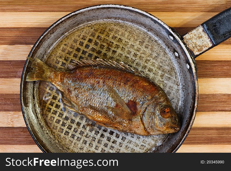 Roasted fish on fried pan