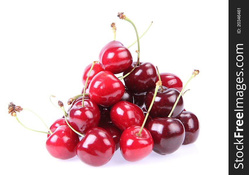 Pile of cherry fruits on a white background