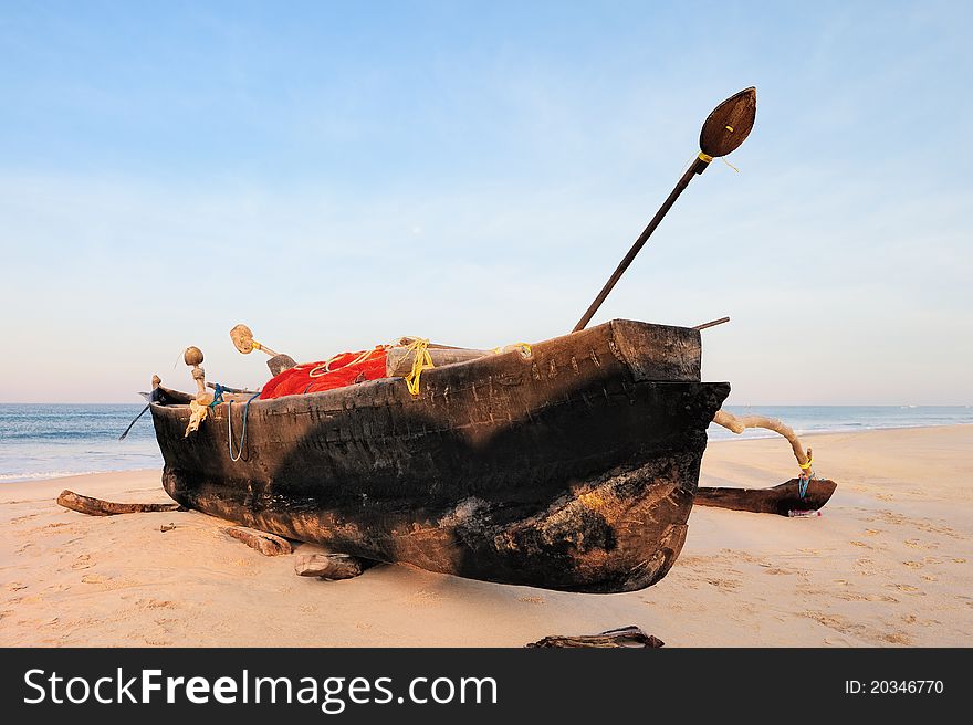 Old fishing boat on the sandy beach in Goa. Old fishing boat on the sandy beach in Goa