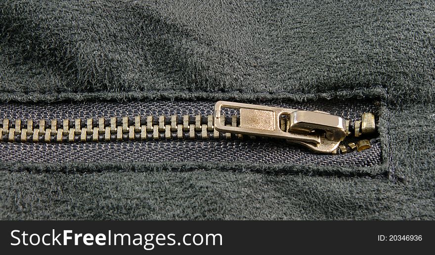 Zipper closeup on grey cloth