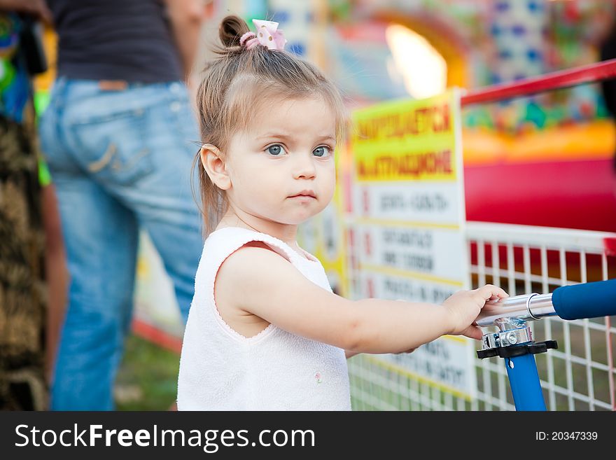 Happy child jumping on trampoline outdoors