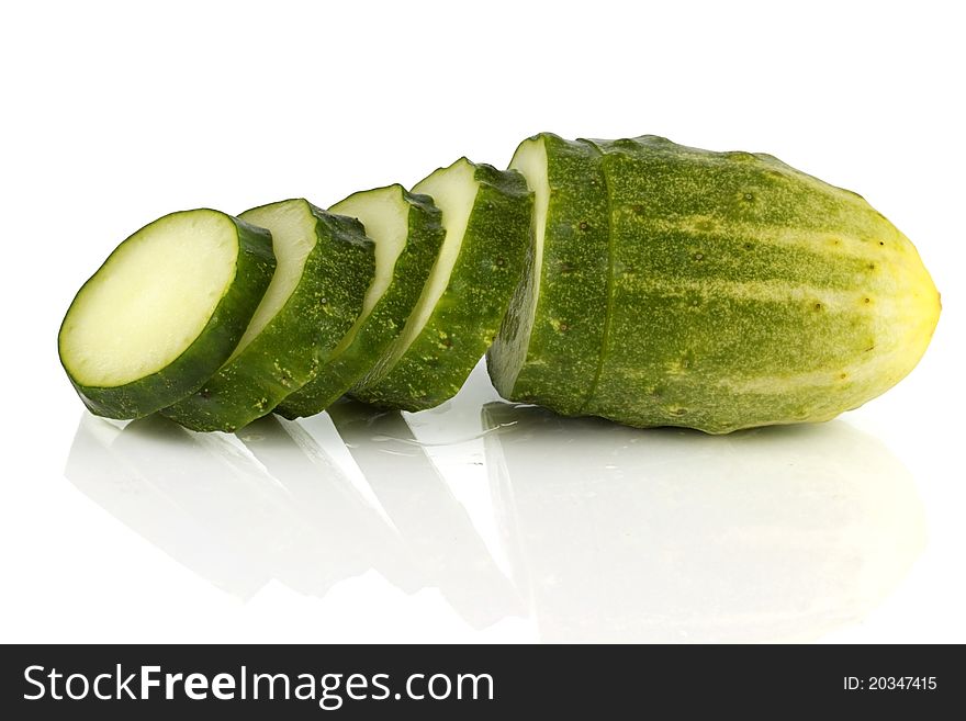 Cucumber in the studio, with reflection on white background. Cucumber in the studio, with reflection on white background.