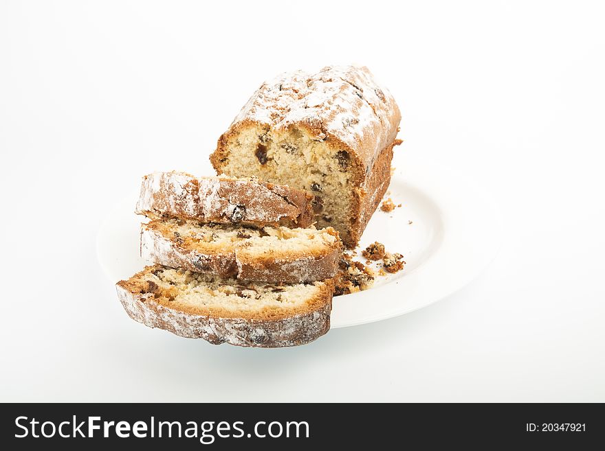 Raisin cake on plate isolated on white background